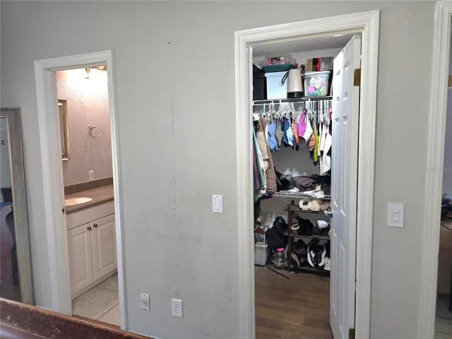 Primary bedroom walk in closet