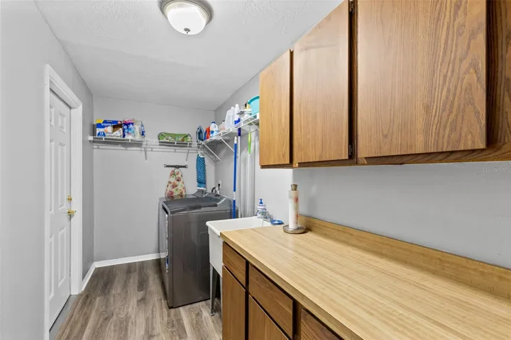 Large Laundry room with plenty of storage