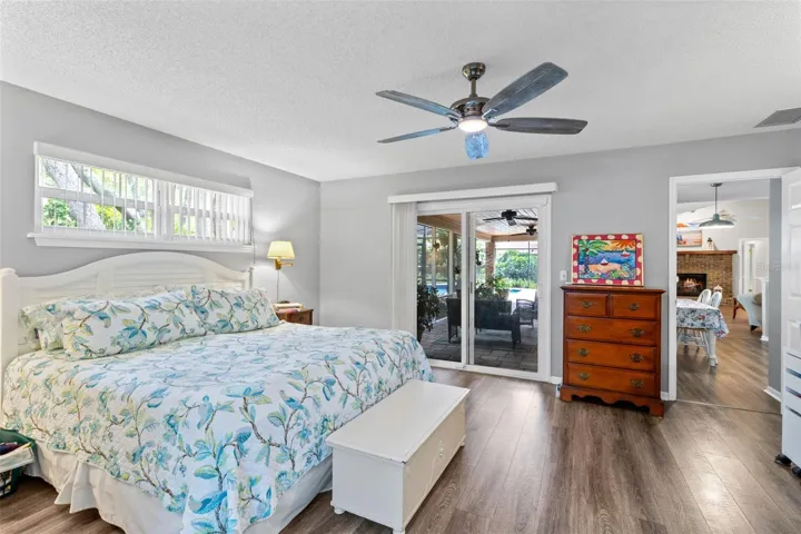 Primary bedroom with sliders to the pool