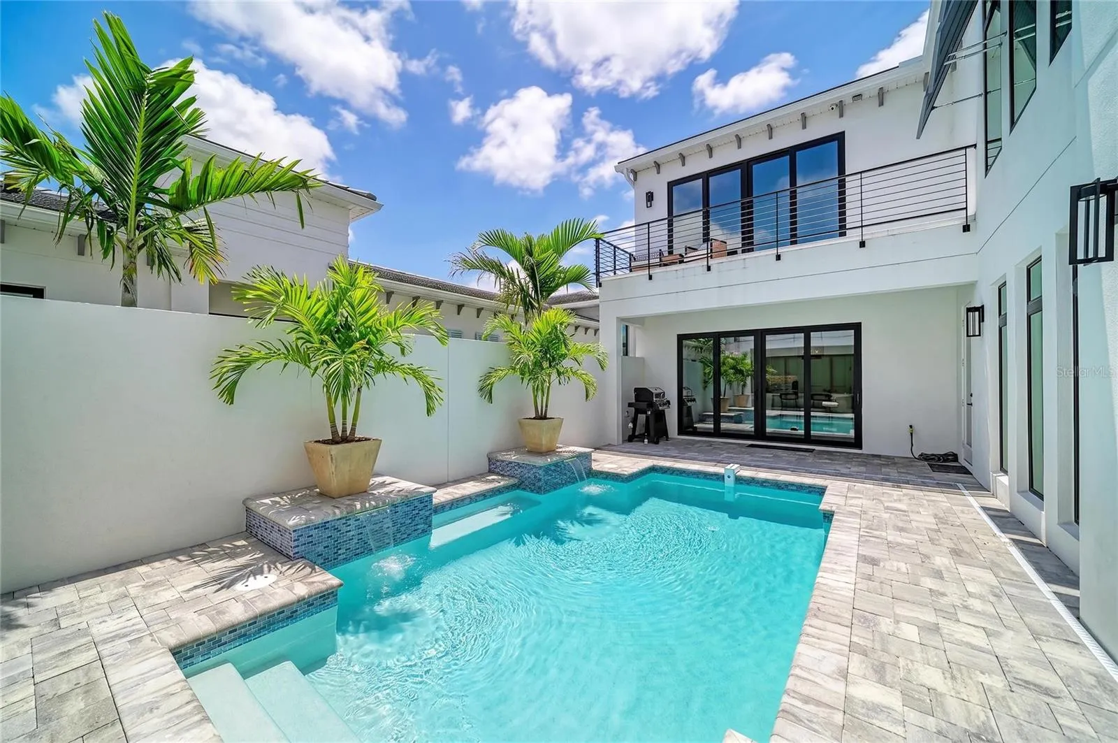 staged palms in pool patio