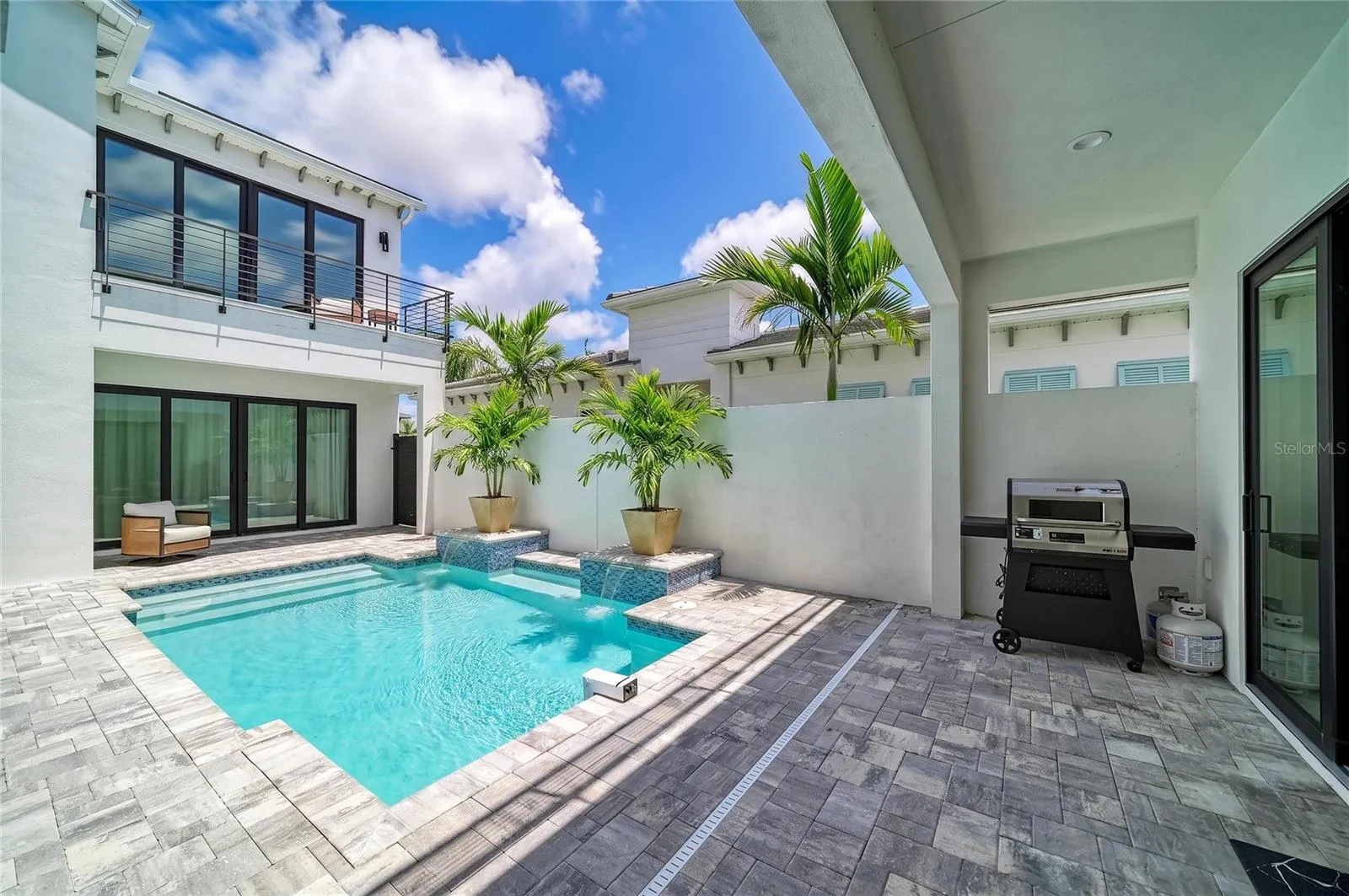 staged palms in pool patio
