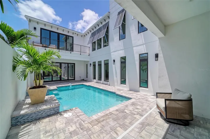 staged palms in pool patio