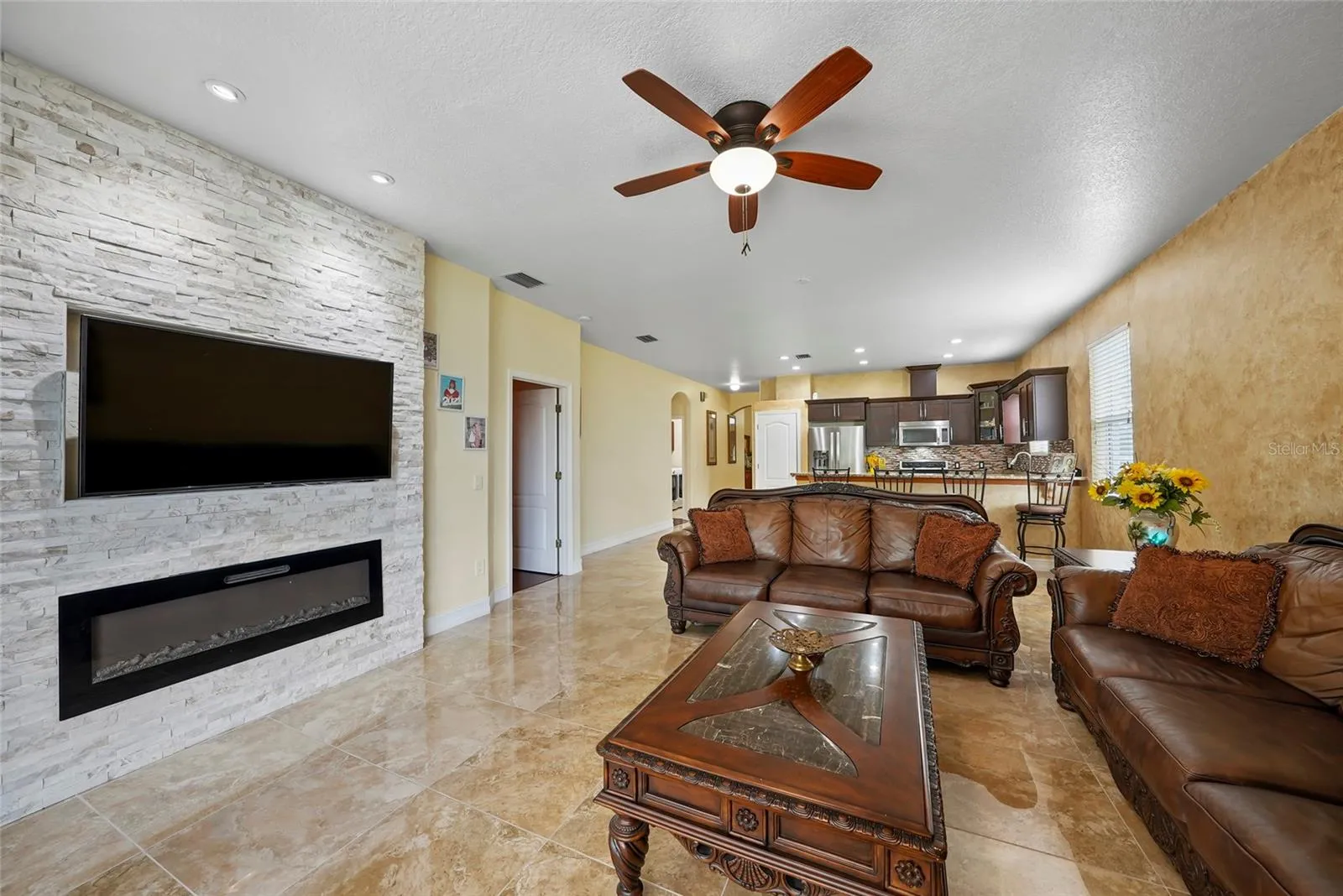 Entertaining/Family Space with Working Fireplace and Custom Media Wall