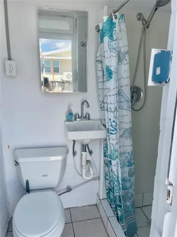 Outside Bathroom.  Perfect when returning from the Beach