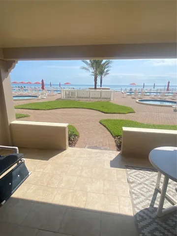 Living Area Porch View Overloks Ocean and both pools along with kiddie pool