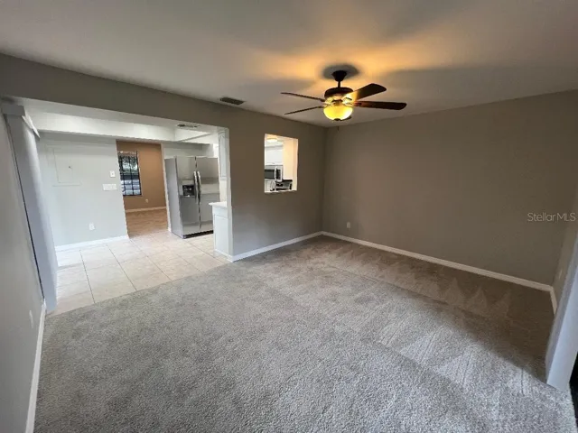 Family room view to dining room , kitchen and living room.