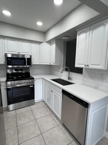 New country sink, counter tops and faucet.