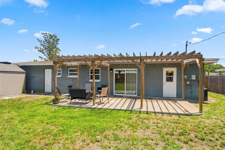 Spacious Backyard with Pergola off the Kitchen.