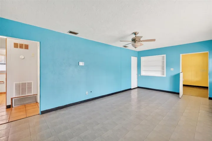 family room, hallway on the left, and dining room on the right