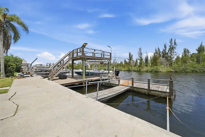 Stunning exterior, large docks, amazing catwalk, boat lift, fish cleaning station.....who could possibly want more!