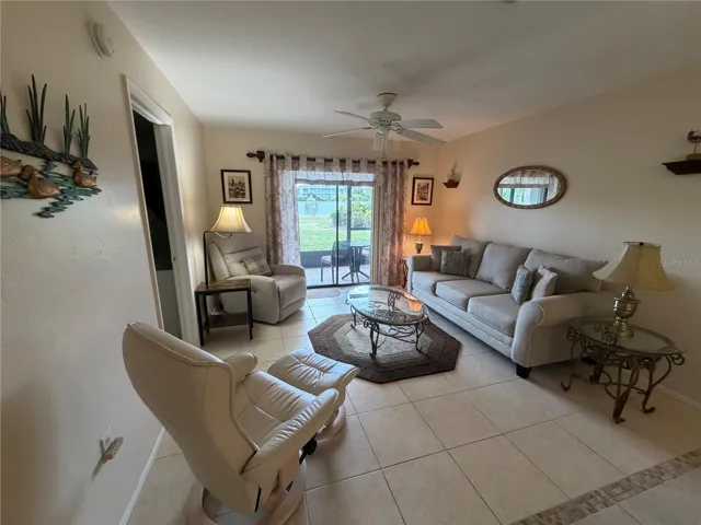 Living Room with Tile Flooring and Sliders to the Lanai