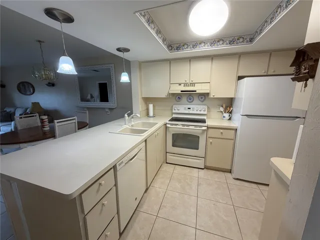 Kitchen with Breakfast Bar and Tile Flooring
