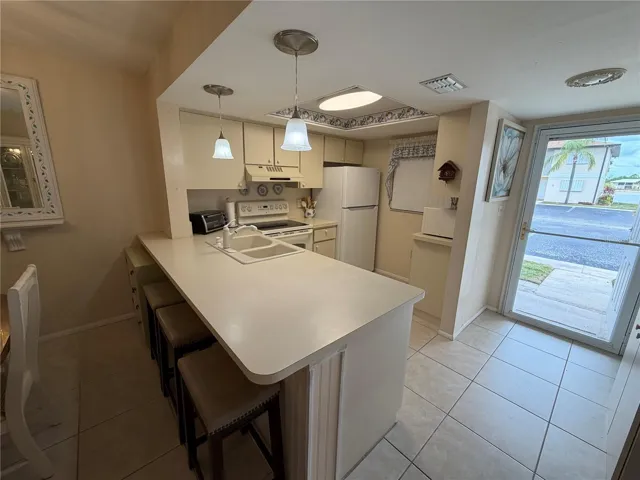 Breakfast Bar to Kitchen, Tile Flooring