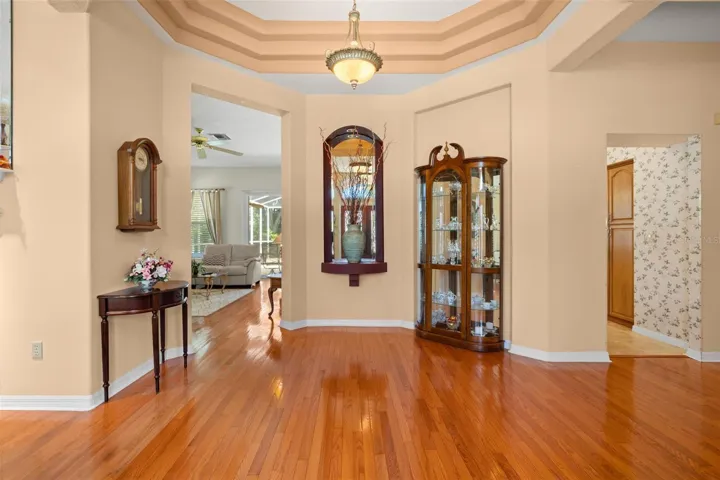 Custom architectural details and a multi-tier tray ceiling create a memorable first impression.