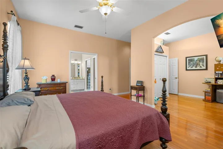 The primary suite features a versatile sitting area, a walk-in closet, and an en-suite bath.
