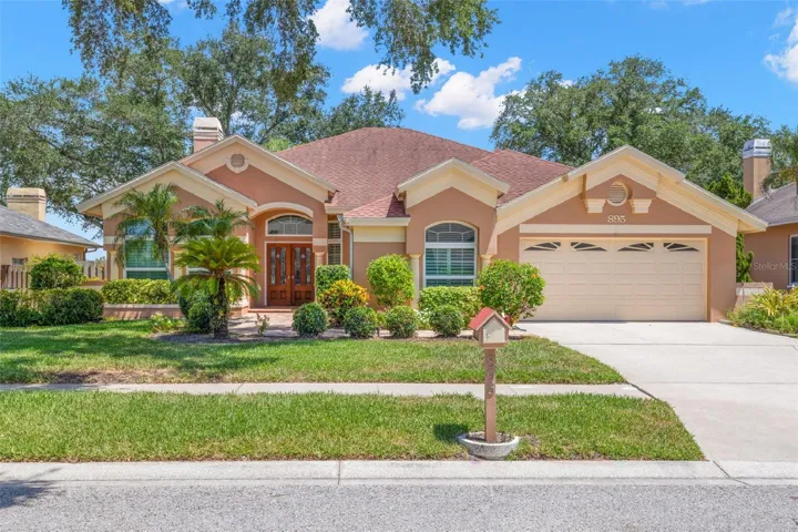 Located in Palm Harbor's highly desirable Piper's Meadow community, this spacious 3-bedroom, 3-bath pool home combines timeless architectural character with a thoughtfully designed floor plan, soaring ceilings, hardwood flooring, and a private screened pool.