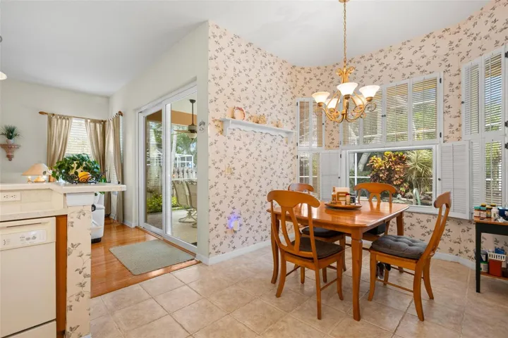 The bright breakfast nook enjoys views of the lanai and an open connection to the adjoining family room.