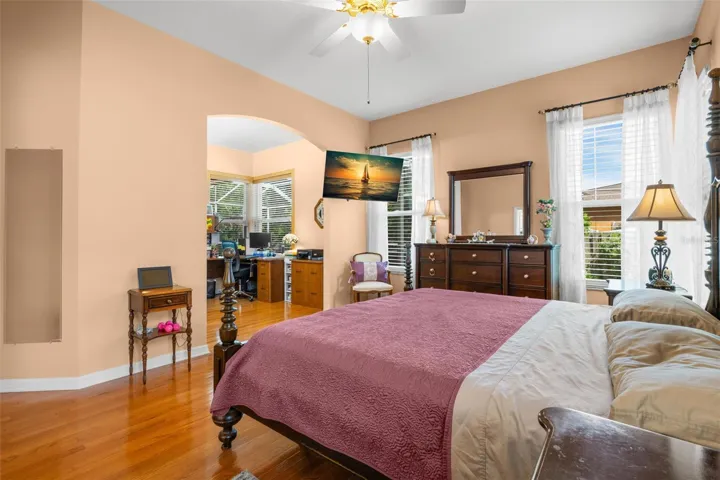The primary suite includes a versatile adjoining space ideal for a home office, sitting room, or personal retreat.