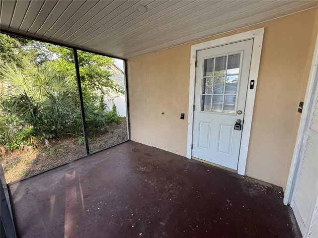 Back screen porch with a washer dryer closet