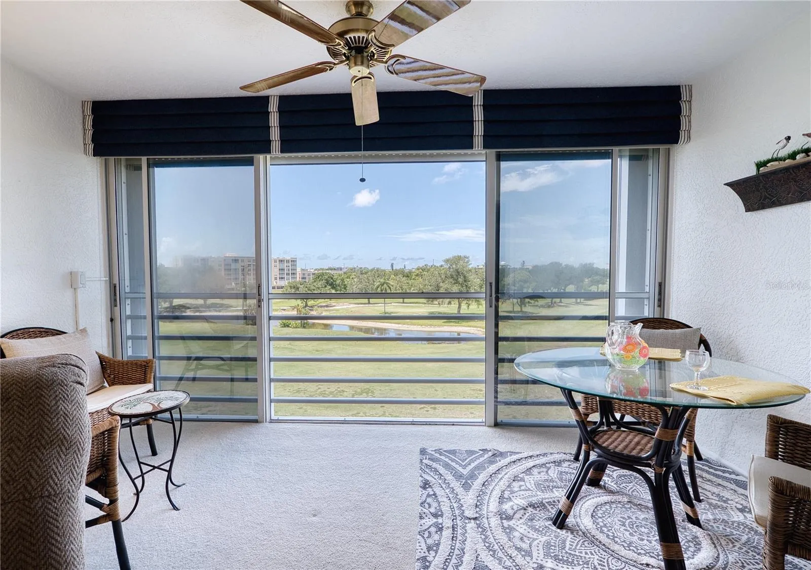 lanai with installed remote controlled metal hurricane shutters
