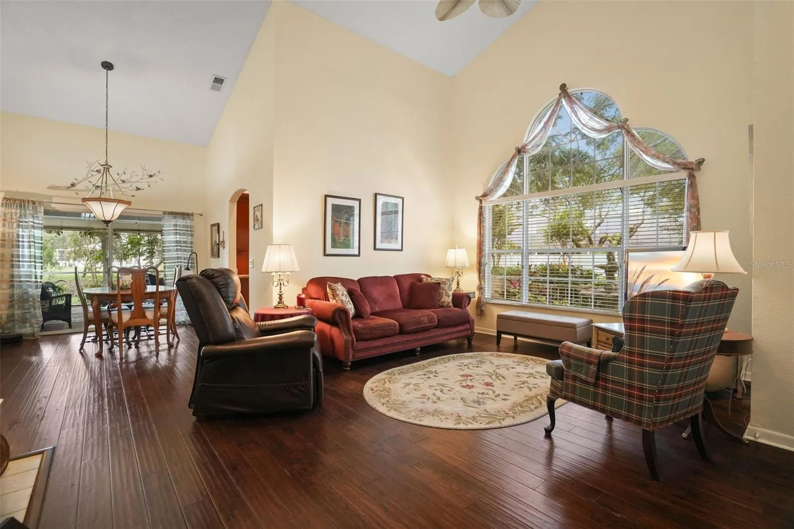 Large family room with a wall of windows for tons of natural light