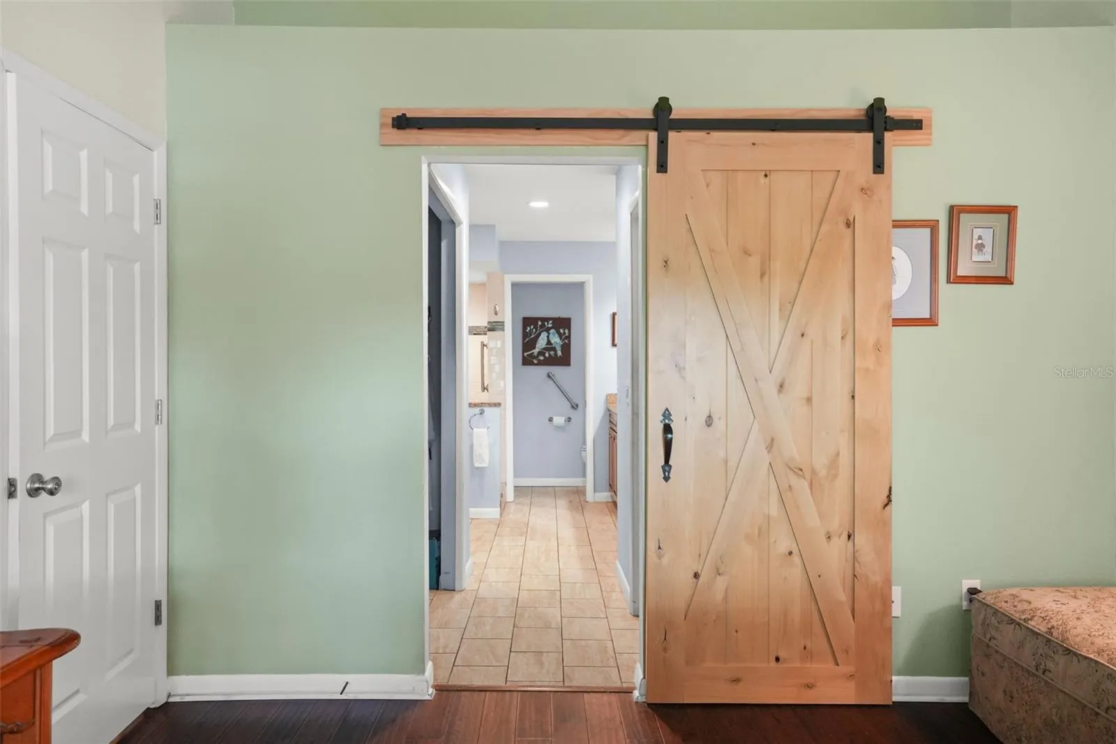 Barn door to the primary ensuite