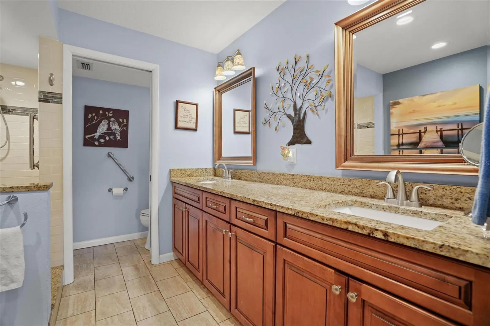 Updated primary ensuite with dual sinks and granite coutertops