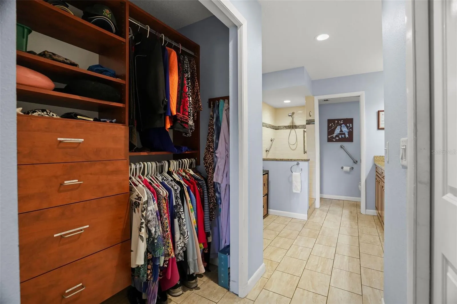 Closet with built ins towards the ensuite