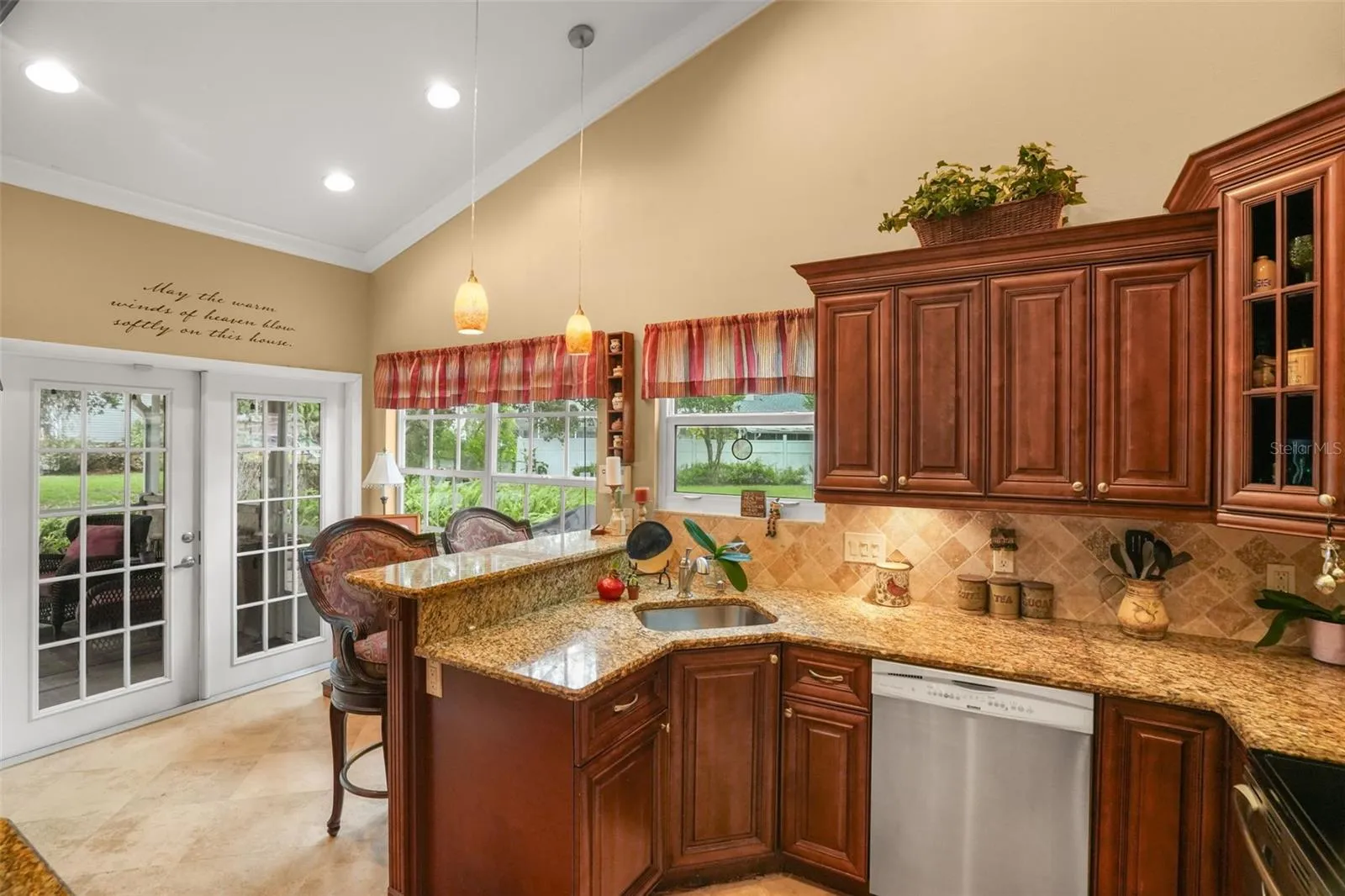 Breakfast bar and breakfast nook with french doors to the lanai