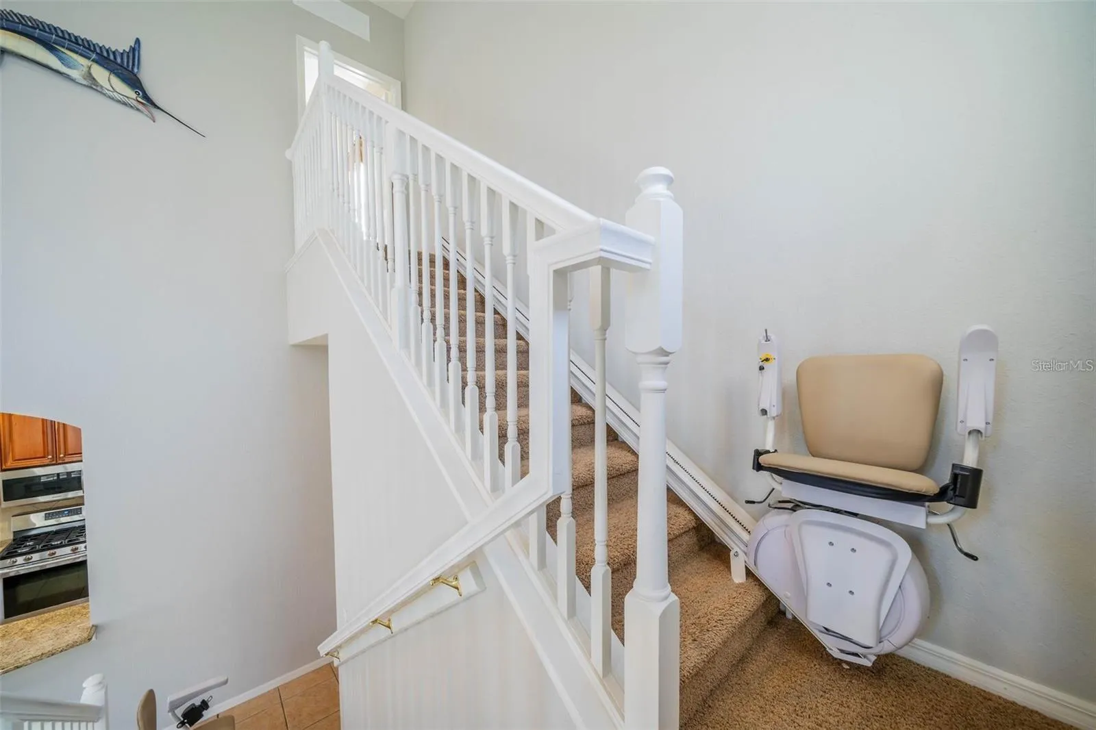 Stairs to bonus room with chairlift.