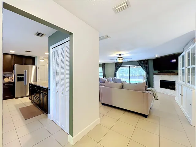 Entry hallway with views to to kitchen and family room.