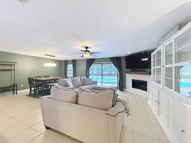 Open floor plan with views of the lanai and pool.