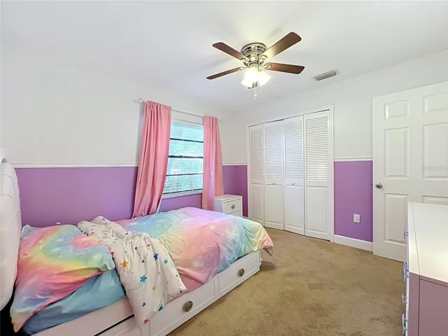 Another view of bedroom 1 with bi-fold closet doors.