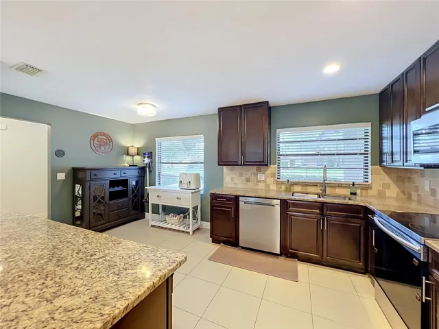 Kitchen with a nook area.
