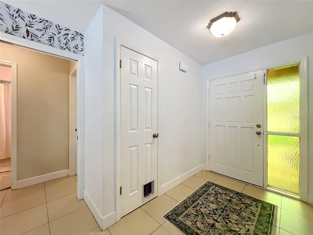 Sliding pocket door leading into 2 bedrooms and bath off of entry hallway. Hall closet for extra storage.