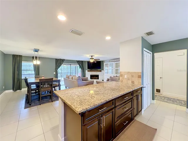Another view of the kitchen bar, entry hallway and closet pantry.