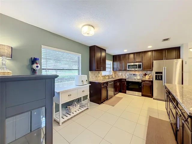 Spacious kitchen and nook area from the hallway entry.