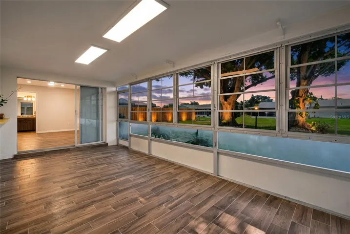 Screened and covered lanai with spacious yard and beautiful mature shade trees!