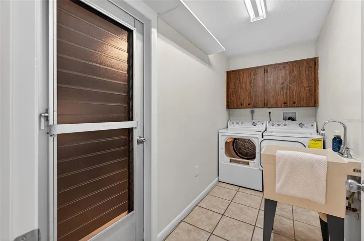 Inside laundry room with utility sink