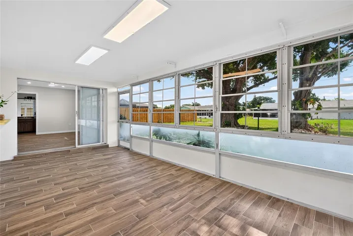 Screened and covered lanai with spacious yard and beautiful mature shade trees!