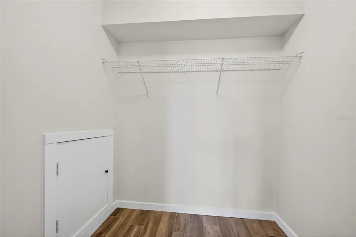 Primary bedroom walk-in closet