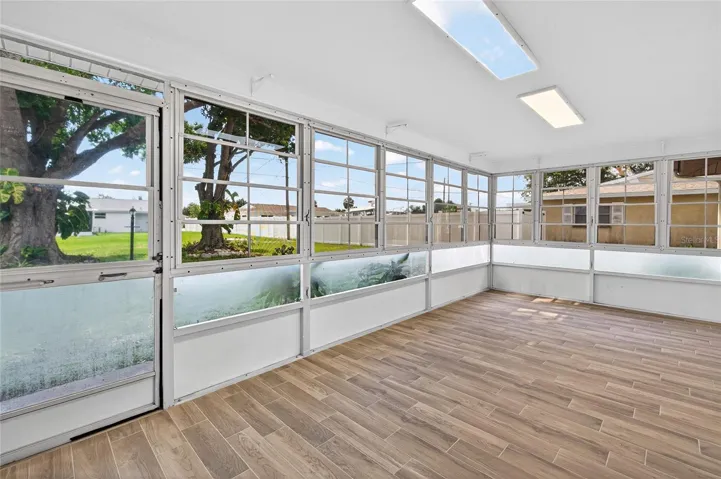 Screened and covered lanai with spacious yard and beautiful mature shade trees!