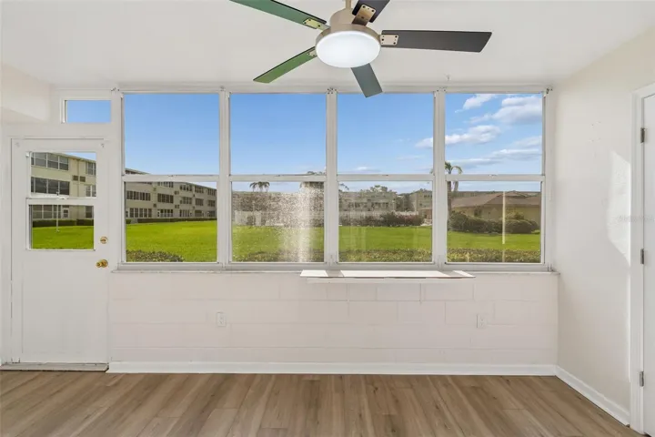 Florida room with view of Courtyard and Pool