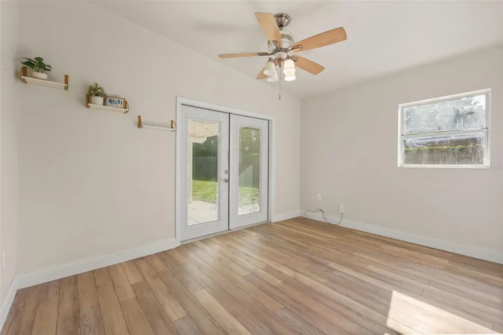 primary bedroom with entry to backporch