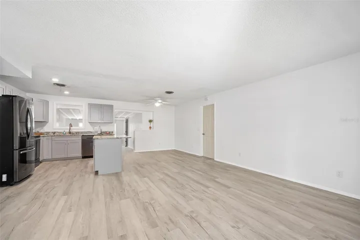Living room, looking toward kitchen and dining area