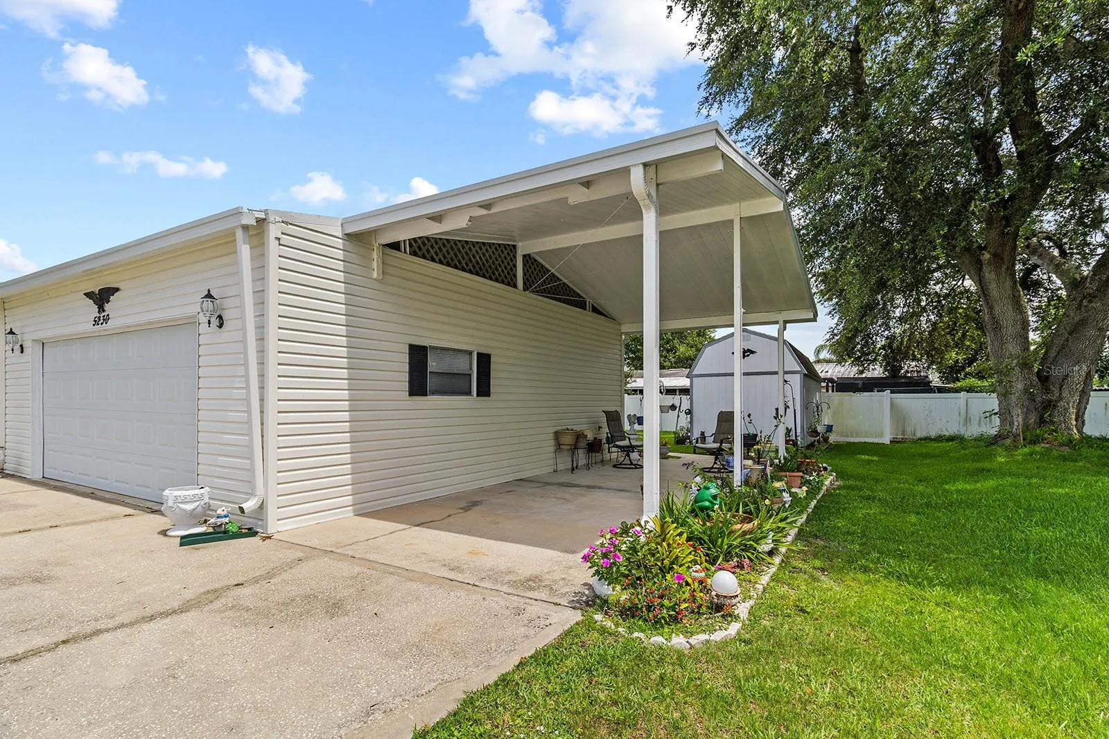 Oversized two car garage and carport