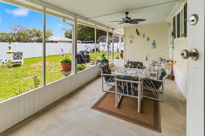 Covered and screened back porch off Florida room