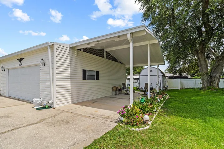 Oversized two car garage and carport