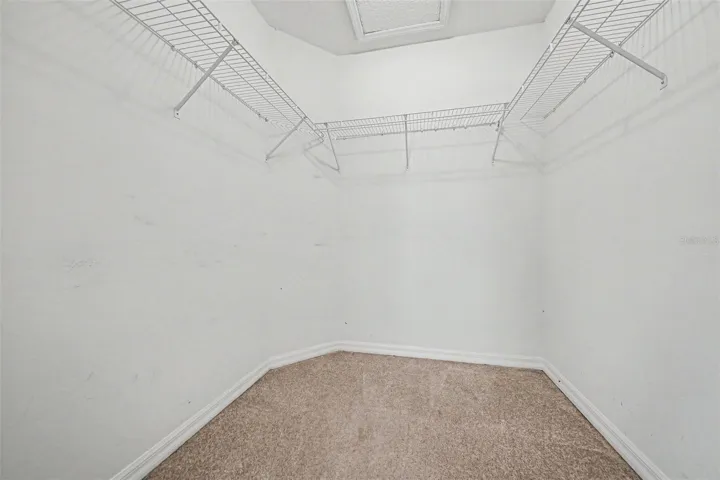 Walk-in closet in primary bedroom