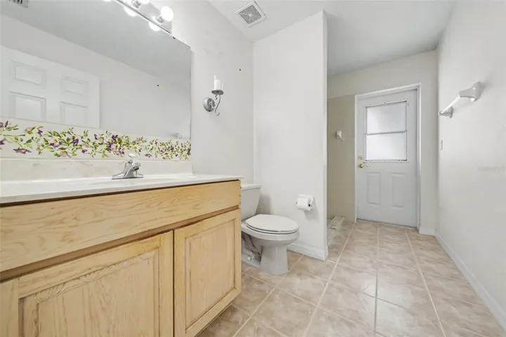 Bathroom 2 - guest bathroom with cabana door to pool deck